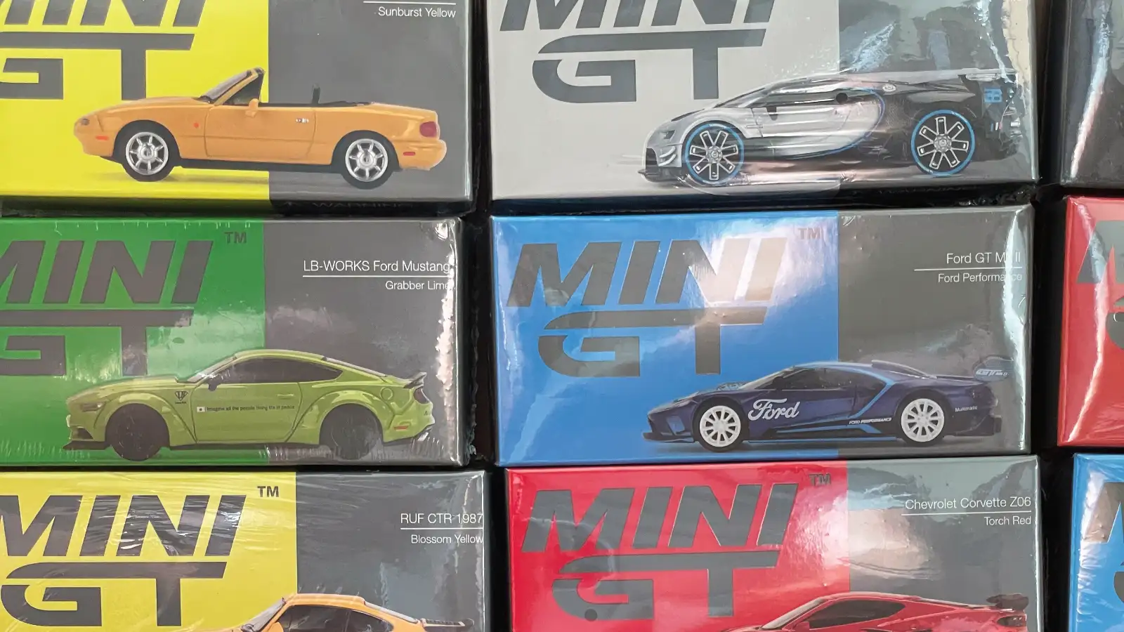Die-cast model cars being packed safely with protective materials for shipping